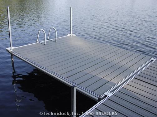 TechniDock aluminum composite floating dock with swim ladder on calm lake