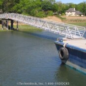 Long aluminum gangway leading to shore